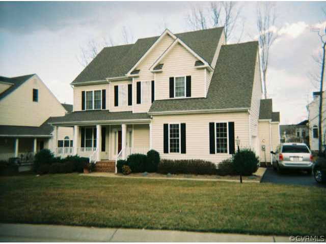 1113 Goswick Ridge Road Midlothian, VA 23114 - Photo 1 of 5 a front view of a house with a garden