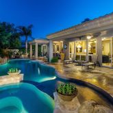 a view of a swimming pool with patio