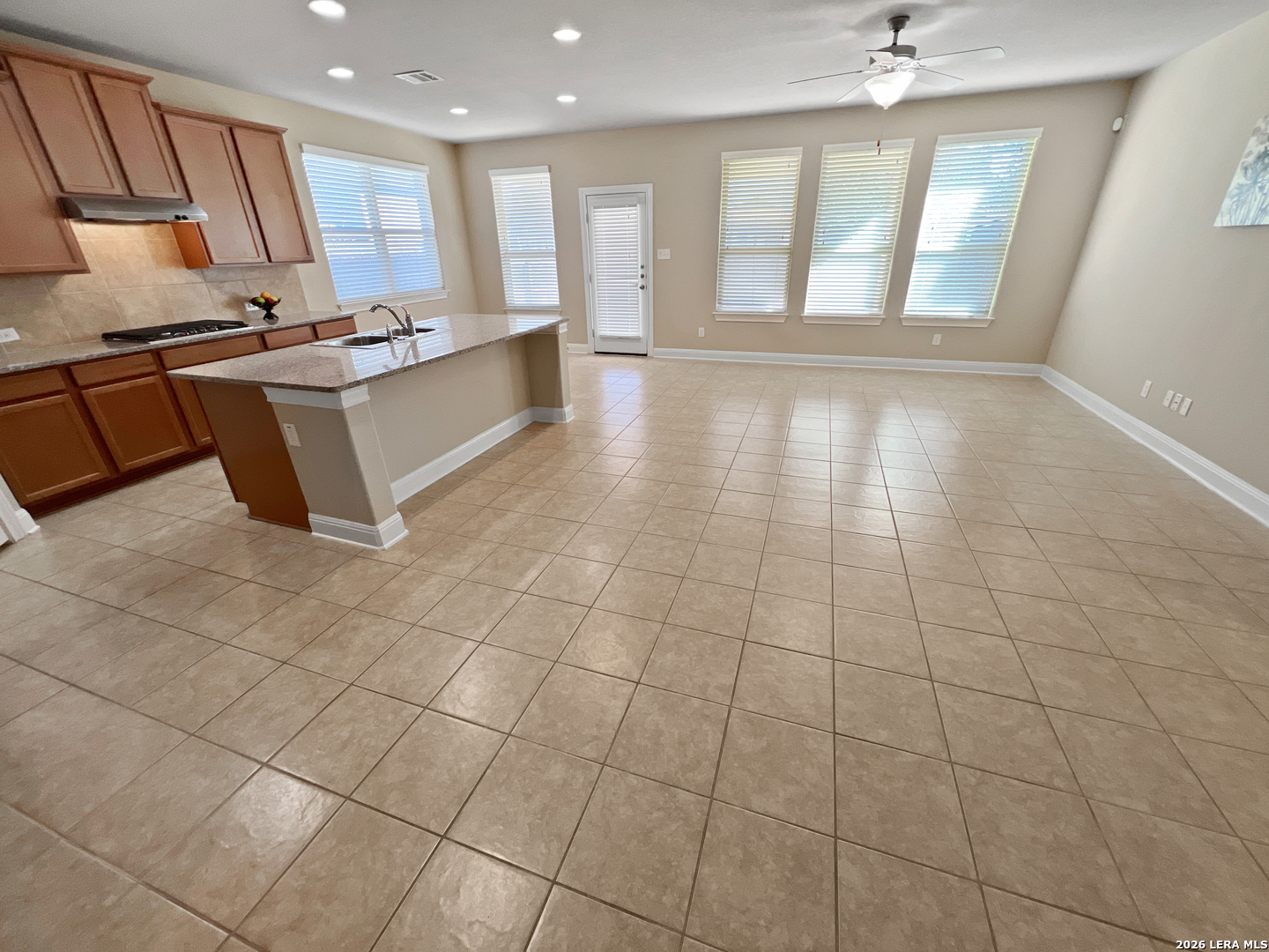 8626 Jogeva Rise San Antonio, TX 78251 - Photo 16 of 44 a large kitchen with stainless steel appliances a sink and cabinets