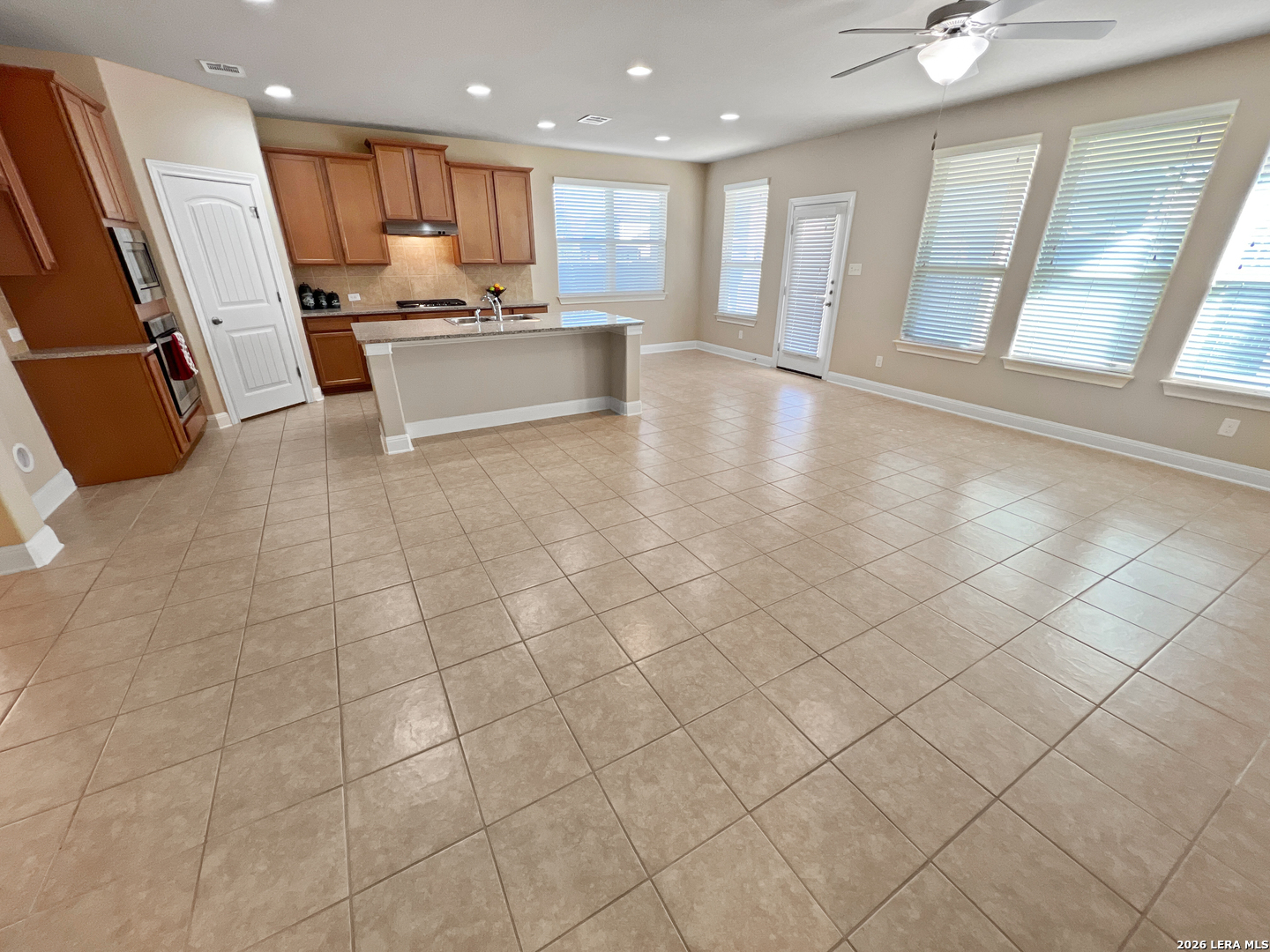 8626 Jogeva Rise San Antonio, TX 78251 - Photo 17 of 44 a large white kitchen with stainless steel appliances