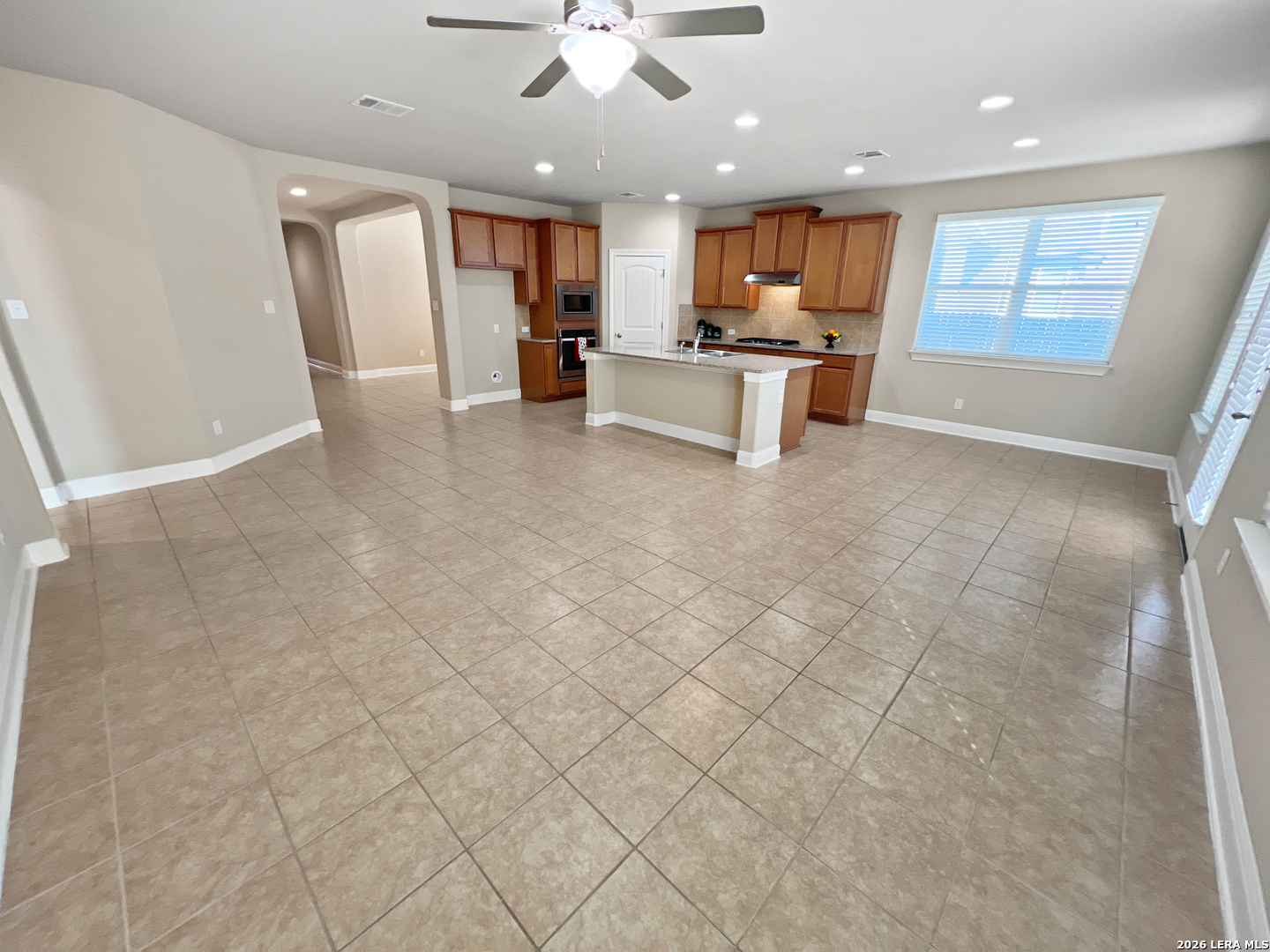 8626 Jogeva Rise San Antonio, TX 78251 - Photo 30 of 44 a view of a living room kitchen and a window