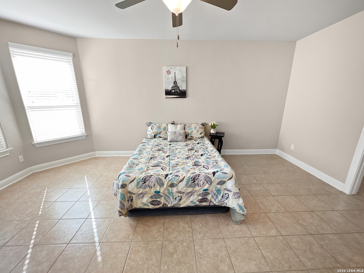 8626 Jogeva Rise San Antonio, TX 78251 - Photo 32 of 44 a bedroom with a bed and a window