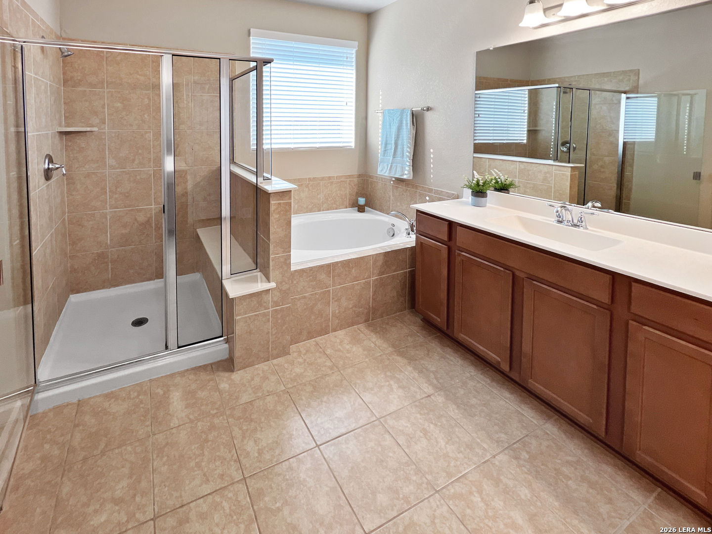 8626 Jogeva Rise San Antonio, TX 78251 - Photo 34 of 44 a spacious bathroom with a tub shower and sink