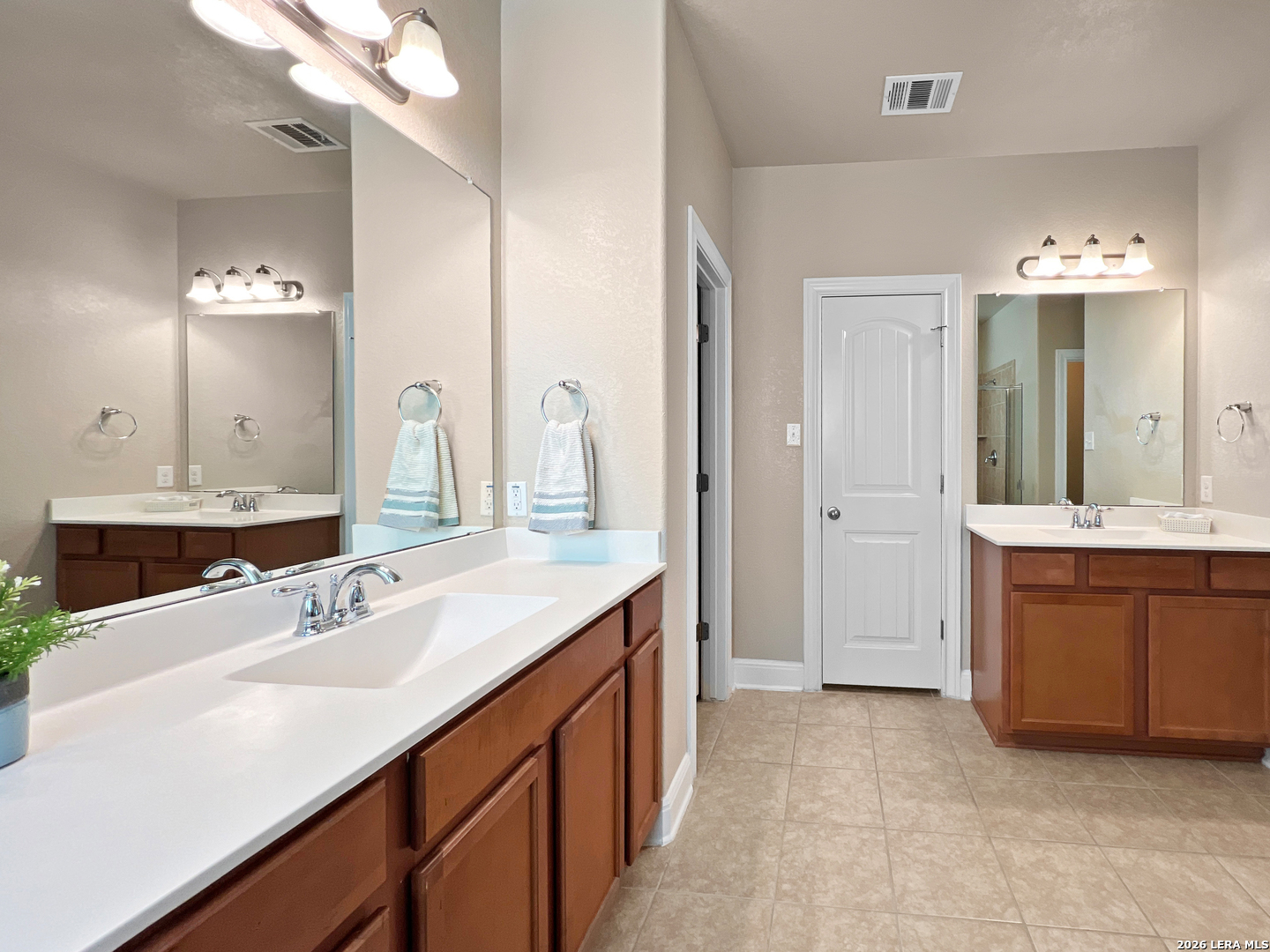 8626 Jogeva Rise San Antonio, TX 78251 - Photo 36 of 44 a bathroom with a sink vanity granite tub and a mirror