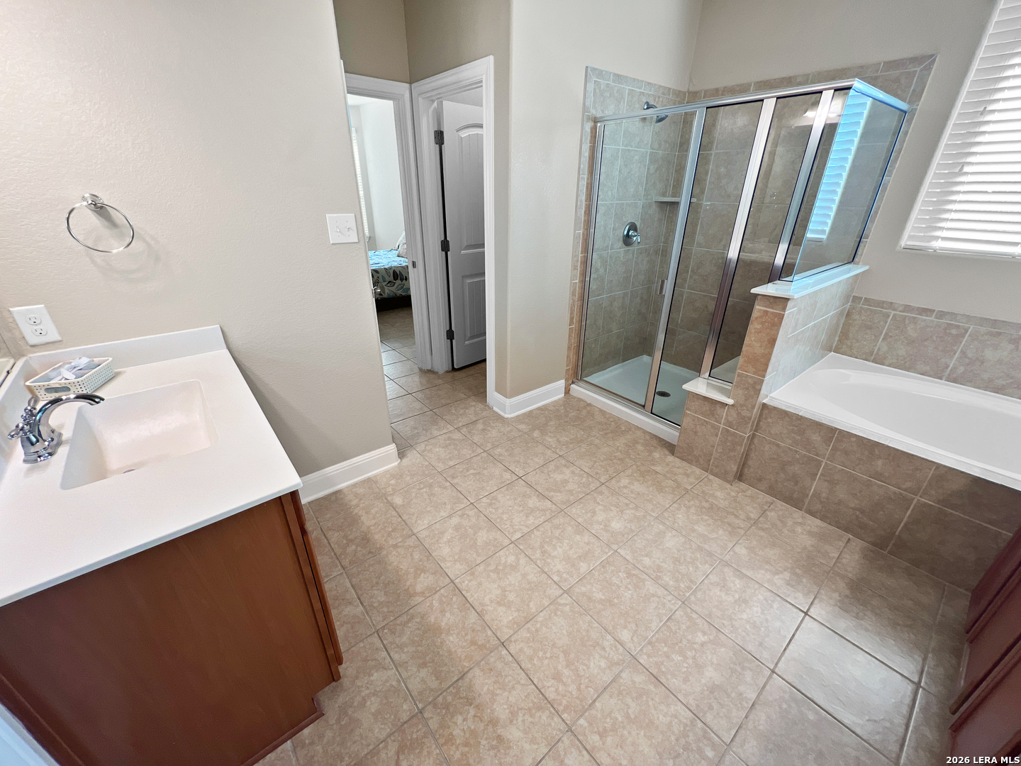 8626 Jogeva Rise San Antonio, TX 78251 - Photo 38 of 44 a view of a bathroom with a sink and a mirror