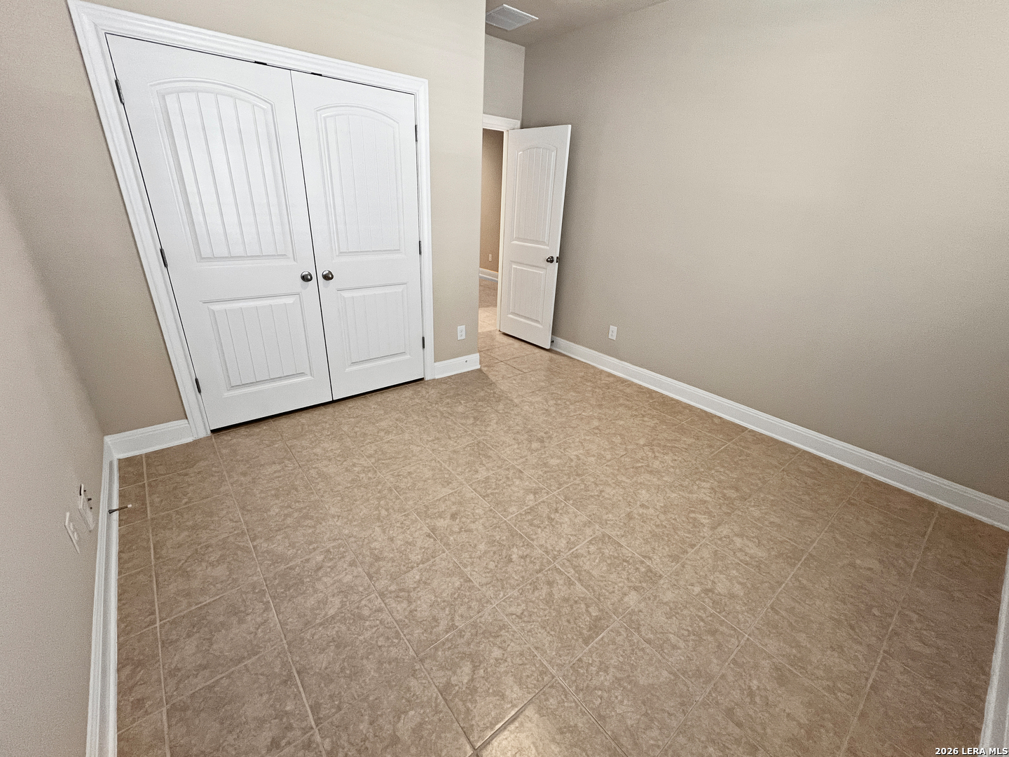 8626 Jogeva Rise San Antonio, TX 78251 - Photo 4 of 44 an empty room with a door