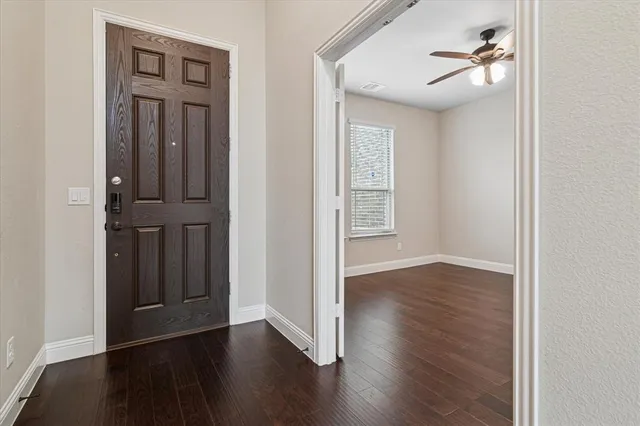 a view of a house with a yard and balcony