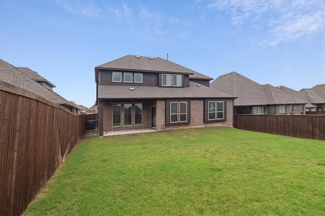 a view of a field with wooden fence