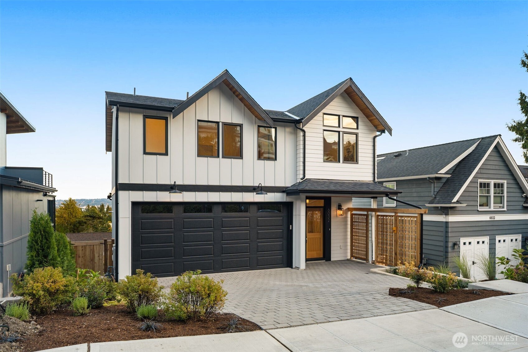 a front view of a house with a garage