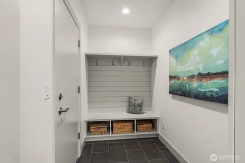 a workspace with wooden floor and furniture