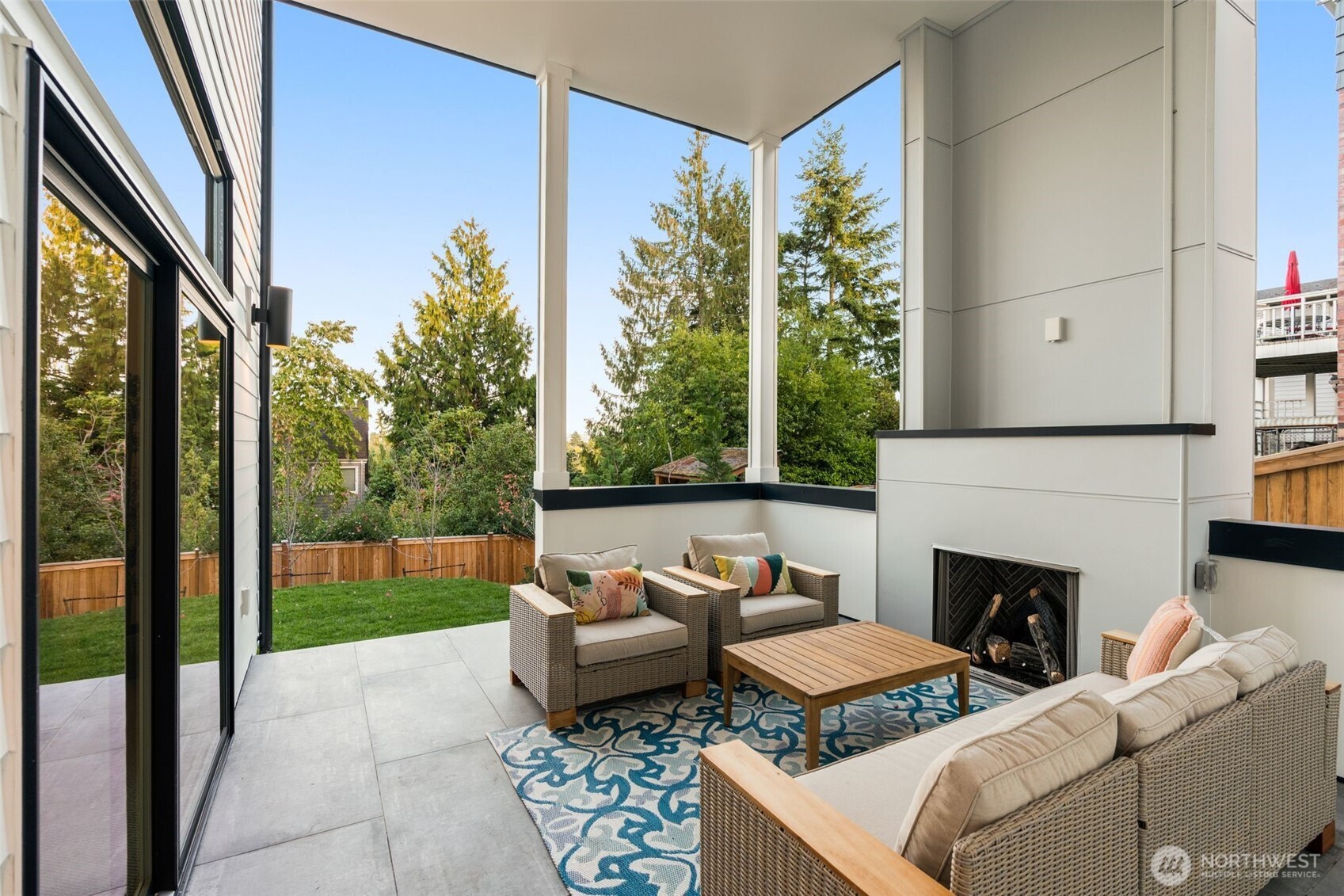 6032 50th Avenue Northeast Seattle, WA 98115 - Photo 28 of 40 a outdoor living space with furniture and a fireplace