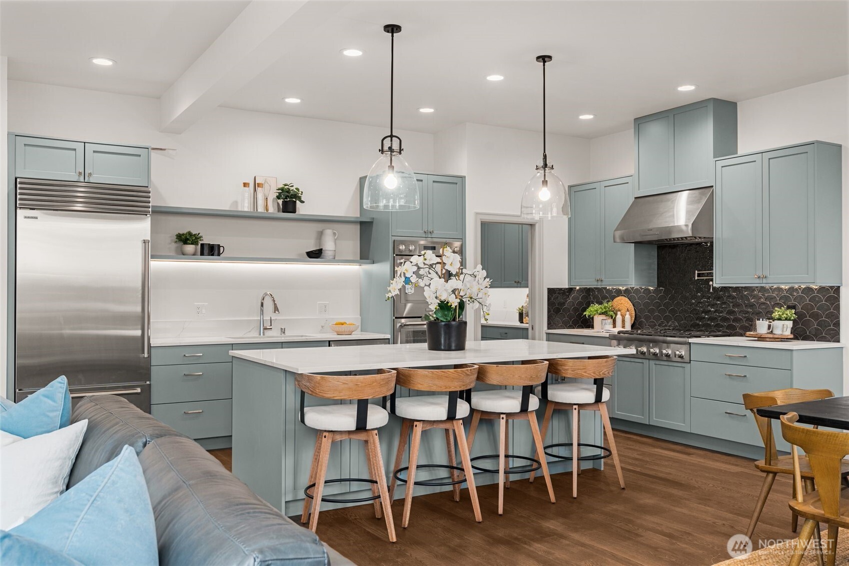 6032 50th Avenue Northeast Seattle, WA 98115 - Photo 3 of 40 a kitchen with kitchen island stainless steel appliances a dining table and chairs
