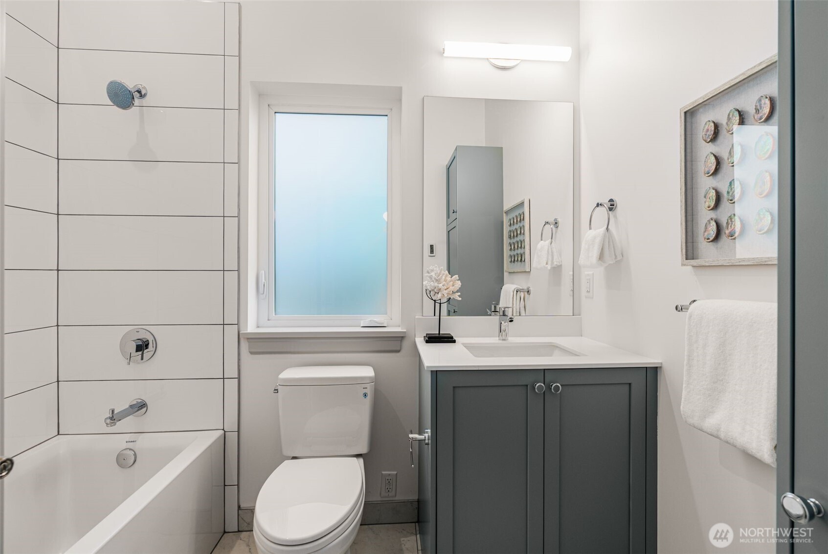 6032 50th Avenue Northeast Seattle, WA 98115 - Photo 32 of 40 a bathroom with a granite countertop sink toilet and shower