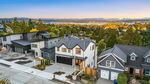 a view of multiple houses with a street