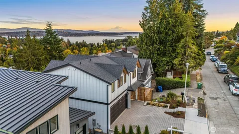an aerial view of residential building with green space