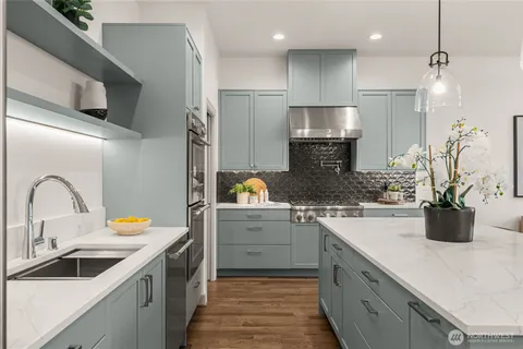 a kitchen with a sink and refrigerator