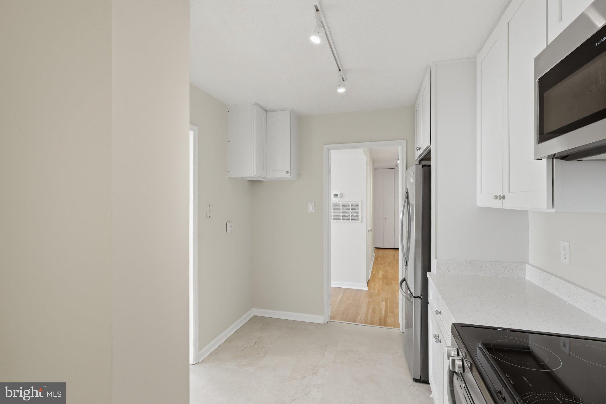 1101 St Paul Street, Unit 1212 Baltimore, MD 21202 - Photo 13 of 36 Modern kitchen with sleek finishes.