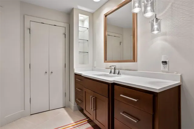 a bathroom with a sink and a mirror