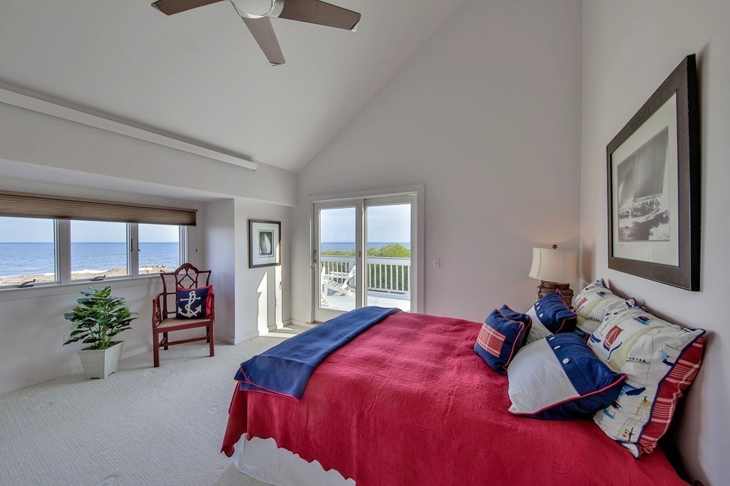 139-138 Atlantic Road Gloucester, MA 01930 - Photo 22 of 28 a bedroom with a bed window and couch