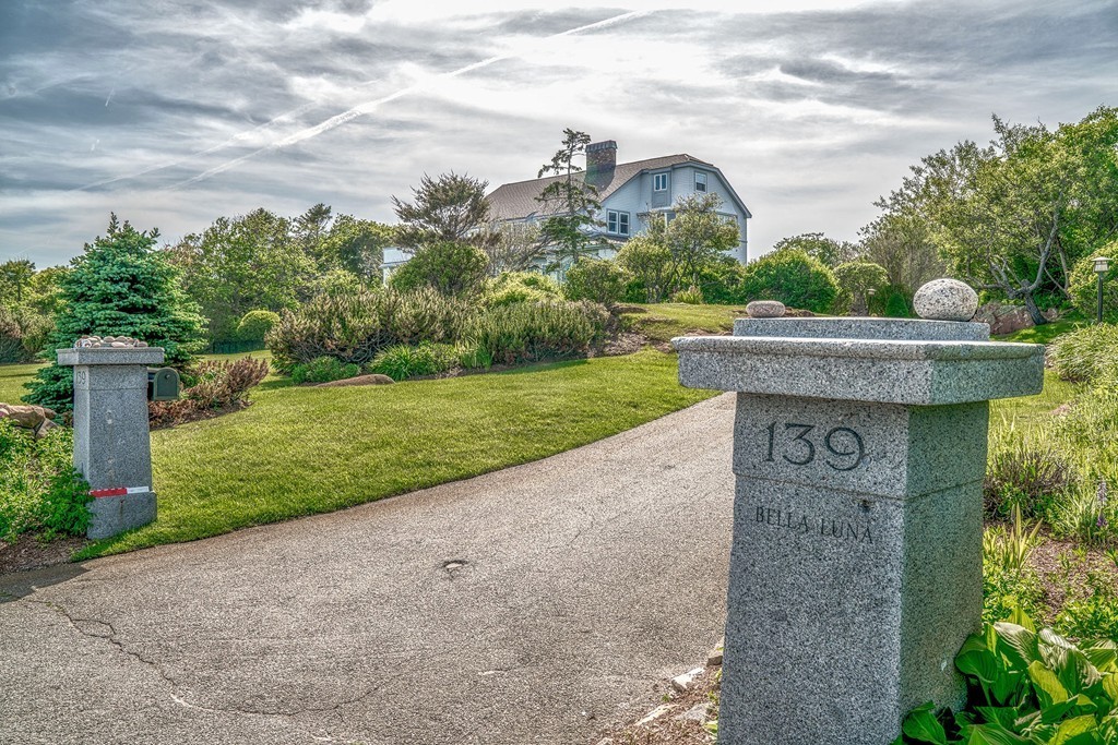 139-138 Atlantic Road Gloucester, MA 01930 - Photo 4 of 28 a view of a stone house with a yard and plants