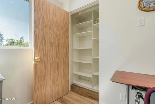 a view of a chair and table in the patio