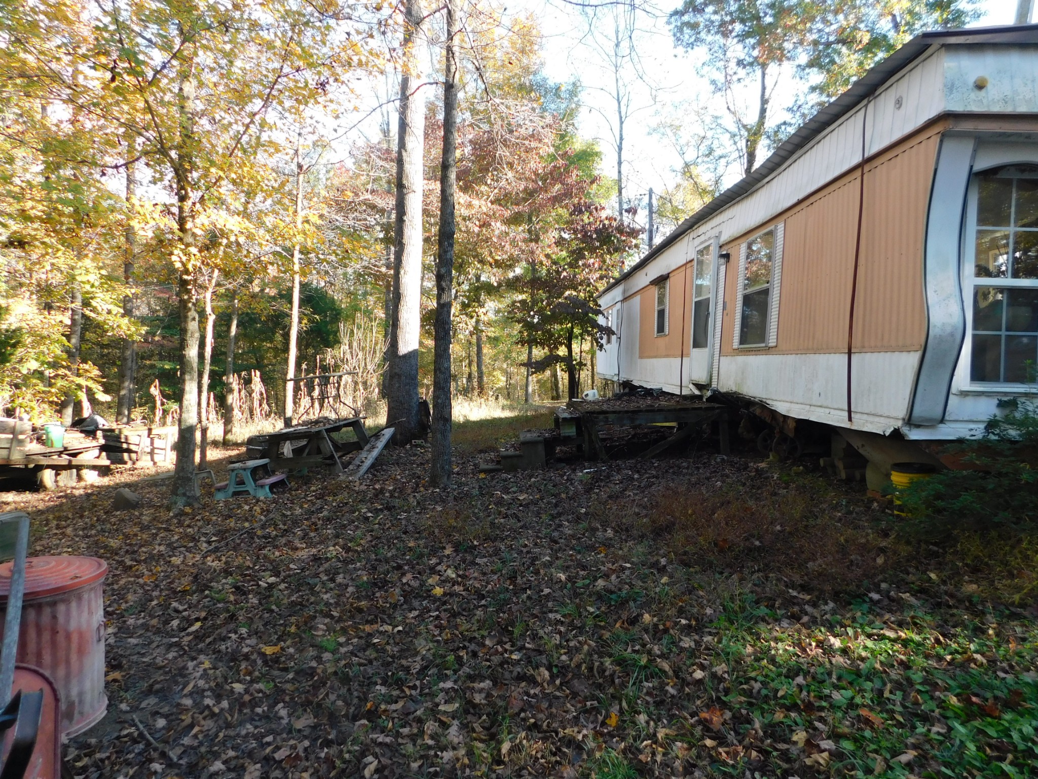 1869 Gander Branch Road Waverly, TN 37185 - Photo 30 of 46 a backyard of a house with chairs and wooden fence