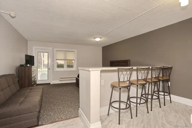 a view of a livingroom with furniture and windows