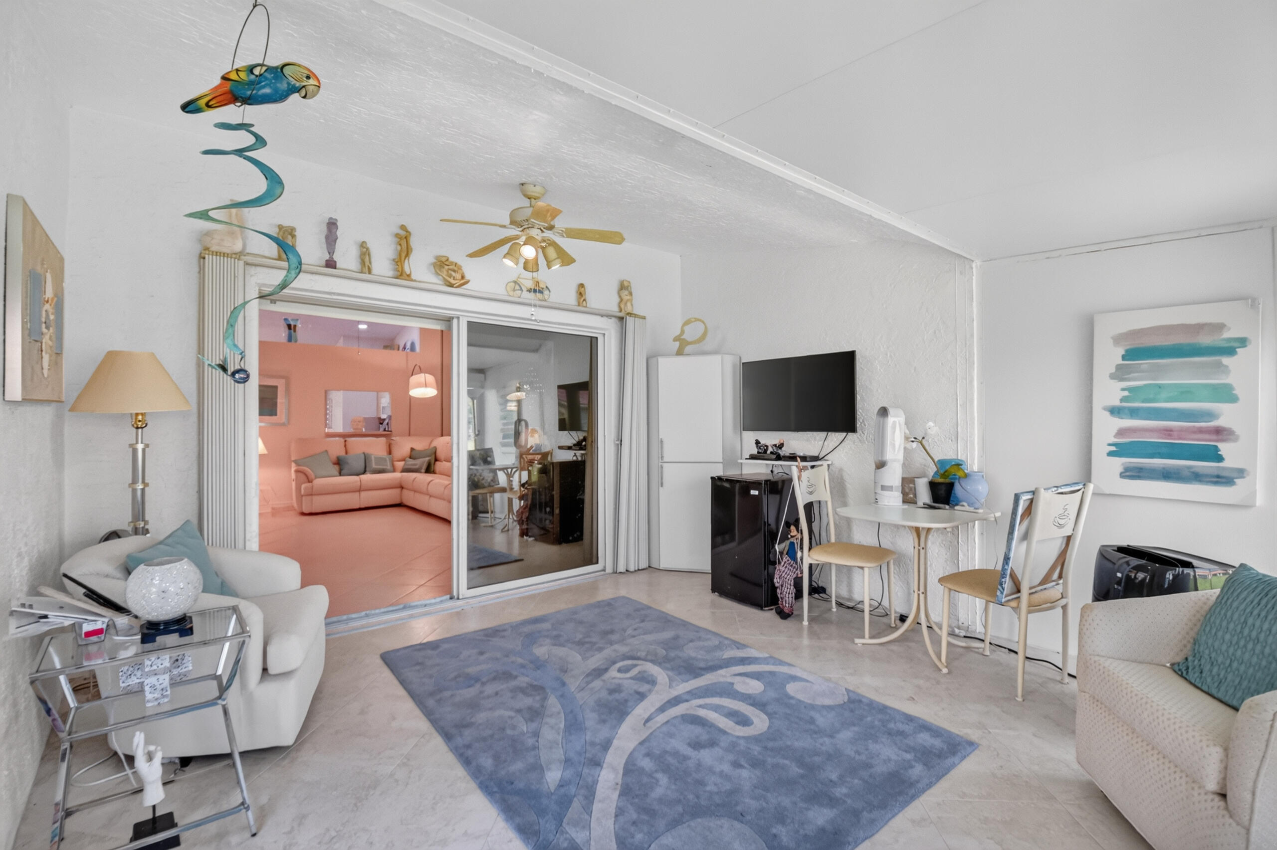 15340 Floral Club Road Delray Beach, FL 33484 - Photo 20 of 42 a living room with furniture and a flat screen tv