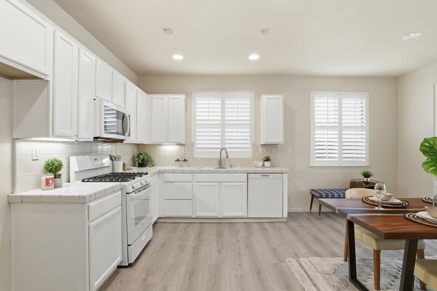 10250 Rudder Way Stockton, CA 95209 - Photo 11 of 46 a kitchen that has a lot of cabinets in it and appliances