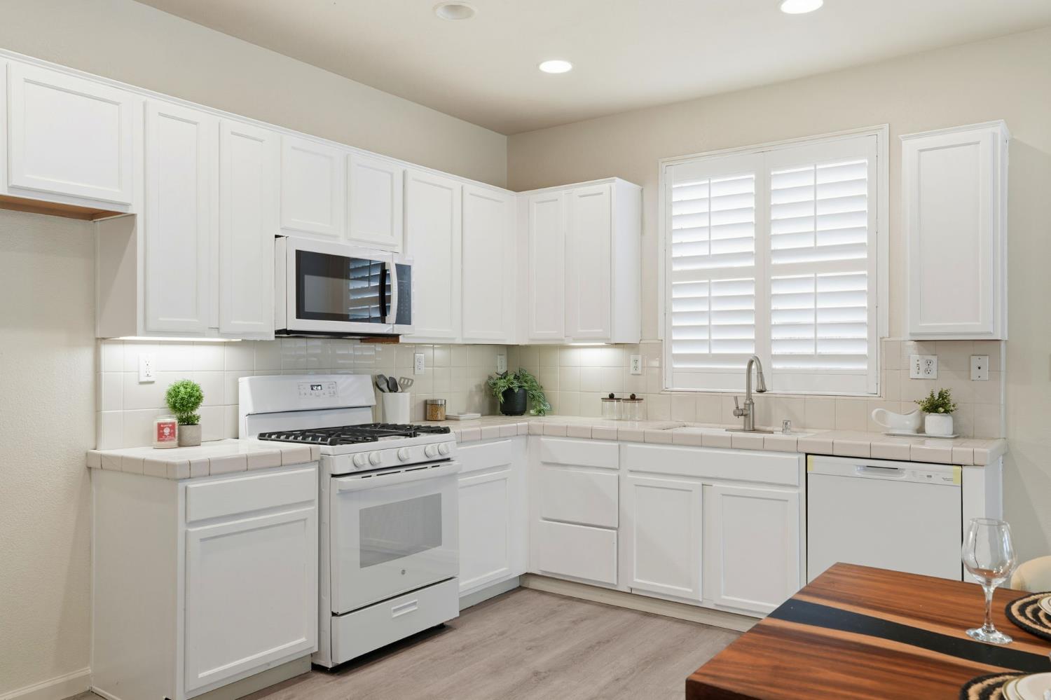 10250 Rudder Way Stockton, CA 95209 - Photo 12 of 46 a kitchen with a sink stove and cabinets