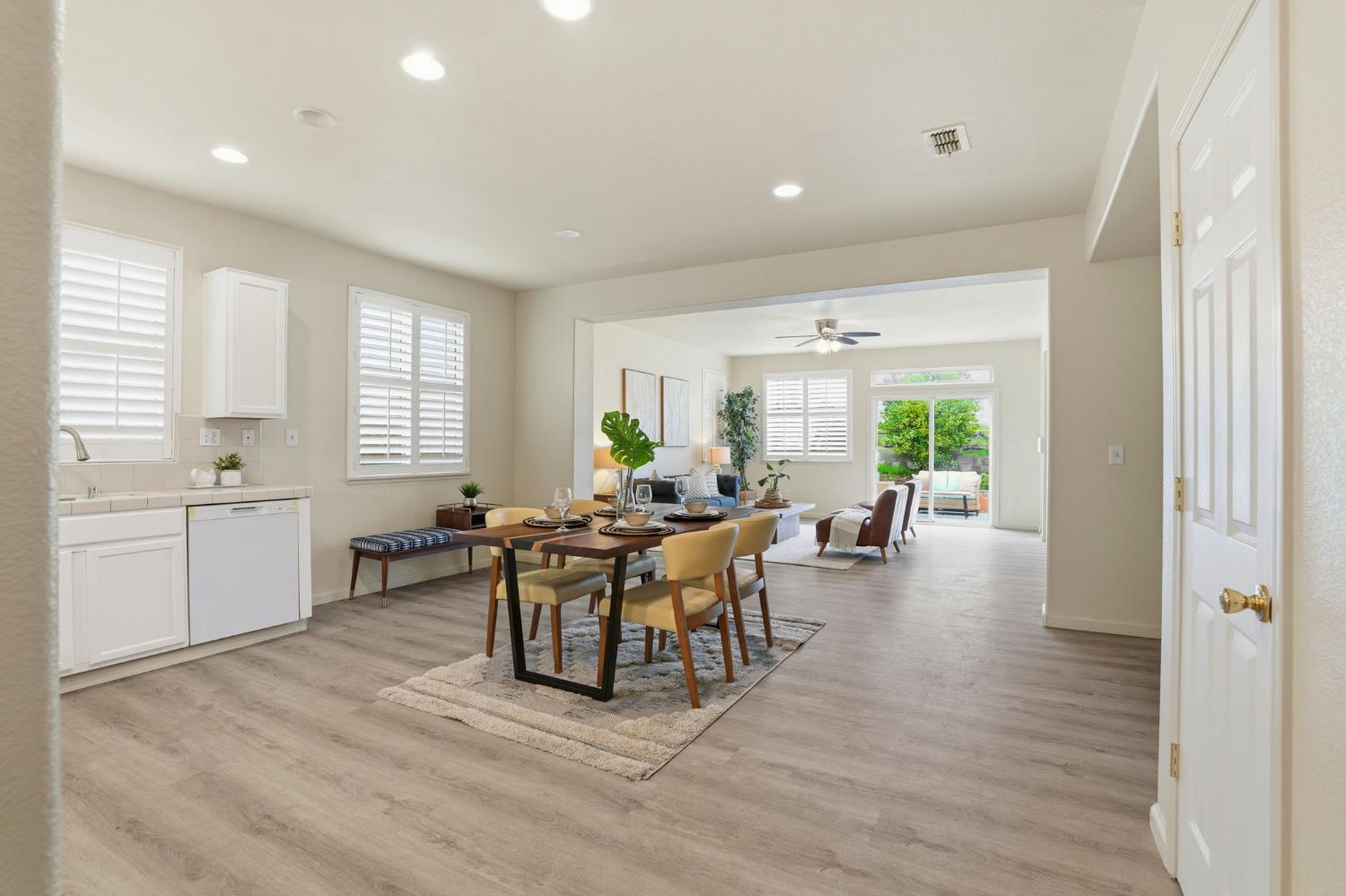10250 Rudder Way Stockton, CA 95209 - Photo 14 of 46 a view of a dining room with furniture and wooden floor