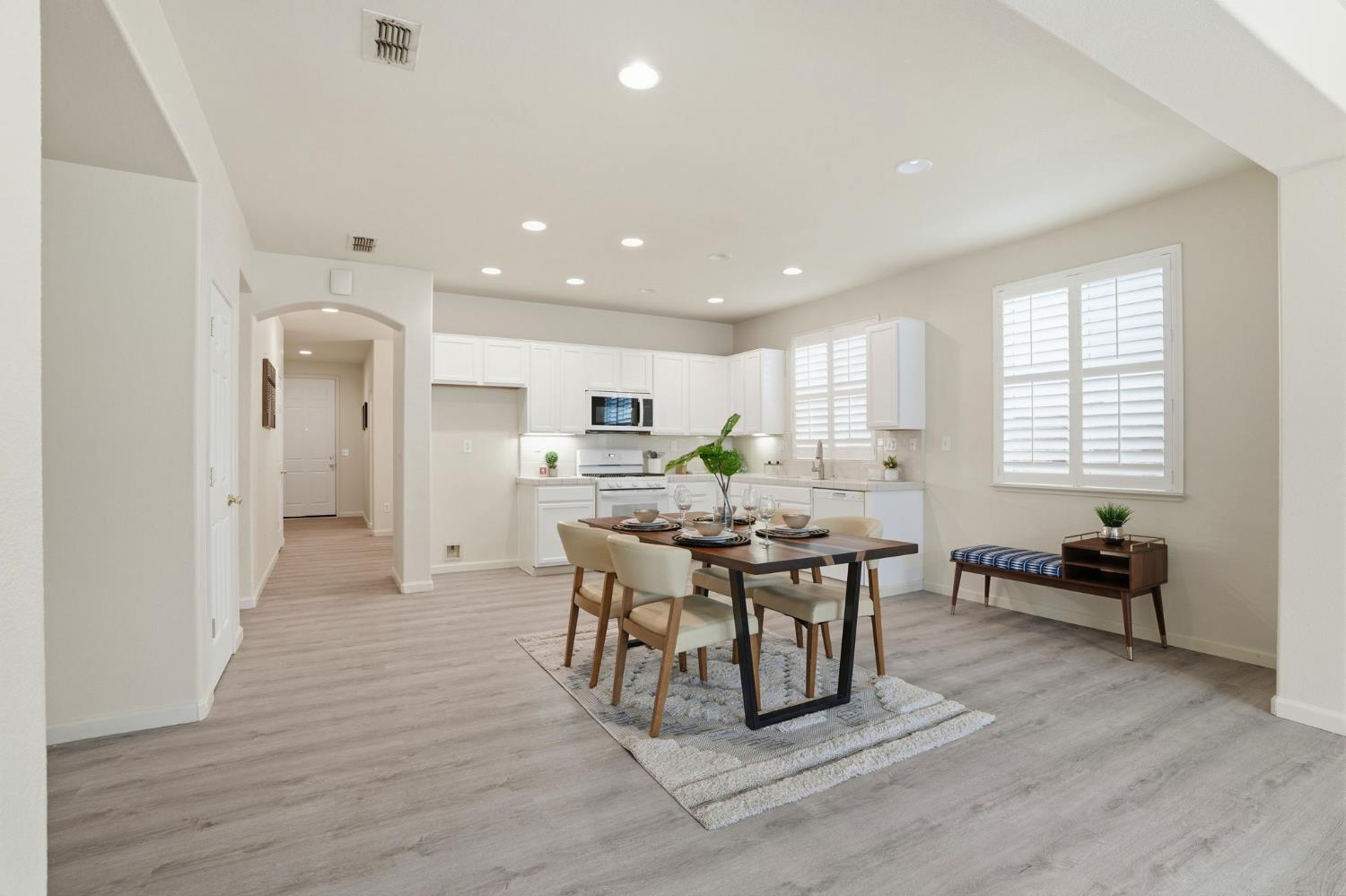 10250 Rudder Way Stockton, CA 95209 - Photo 15 of 46 a view of a dining room with furniture and wooden floor