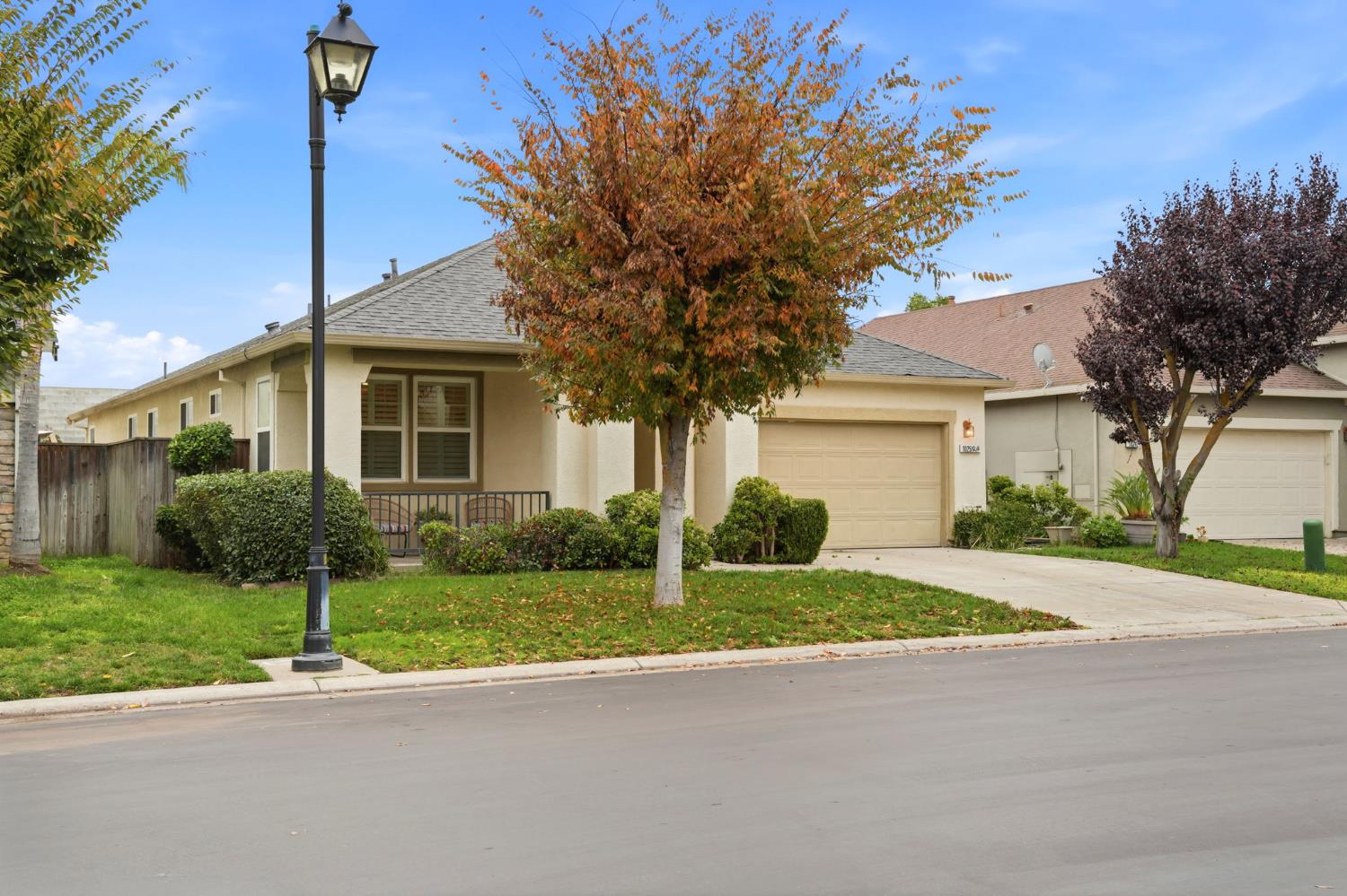 10250 Rudder Way Stockton, CA 95209 - Photo 2 of 46 a front view of a house with a yard and garage