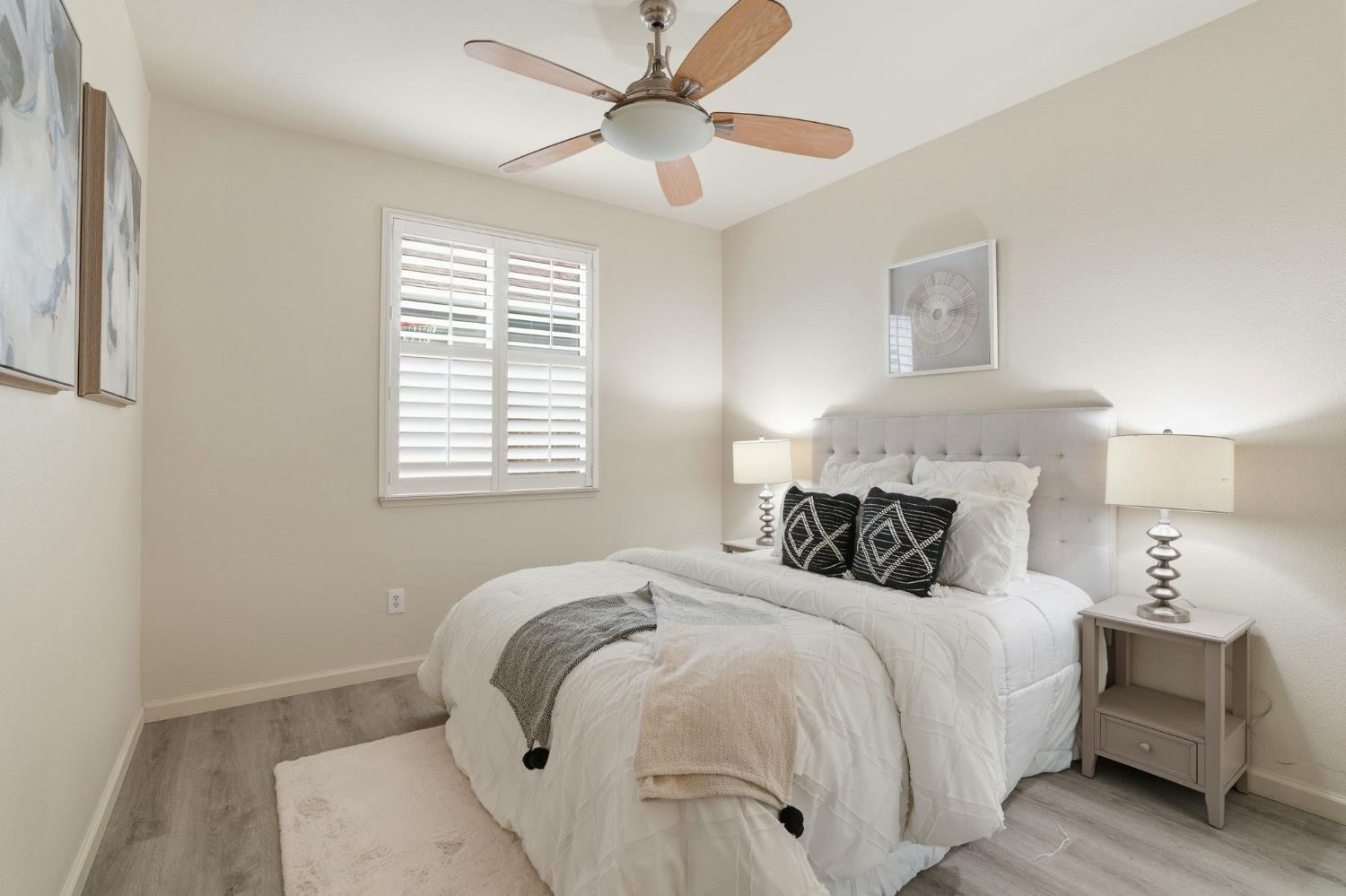 10250 Rudder Way Stockton, CA 95209 - Photo 21 of 46 a bed room with a bed and a chandelier