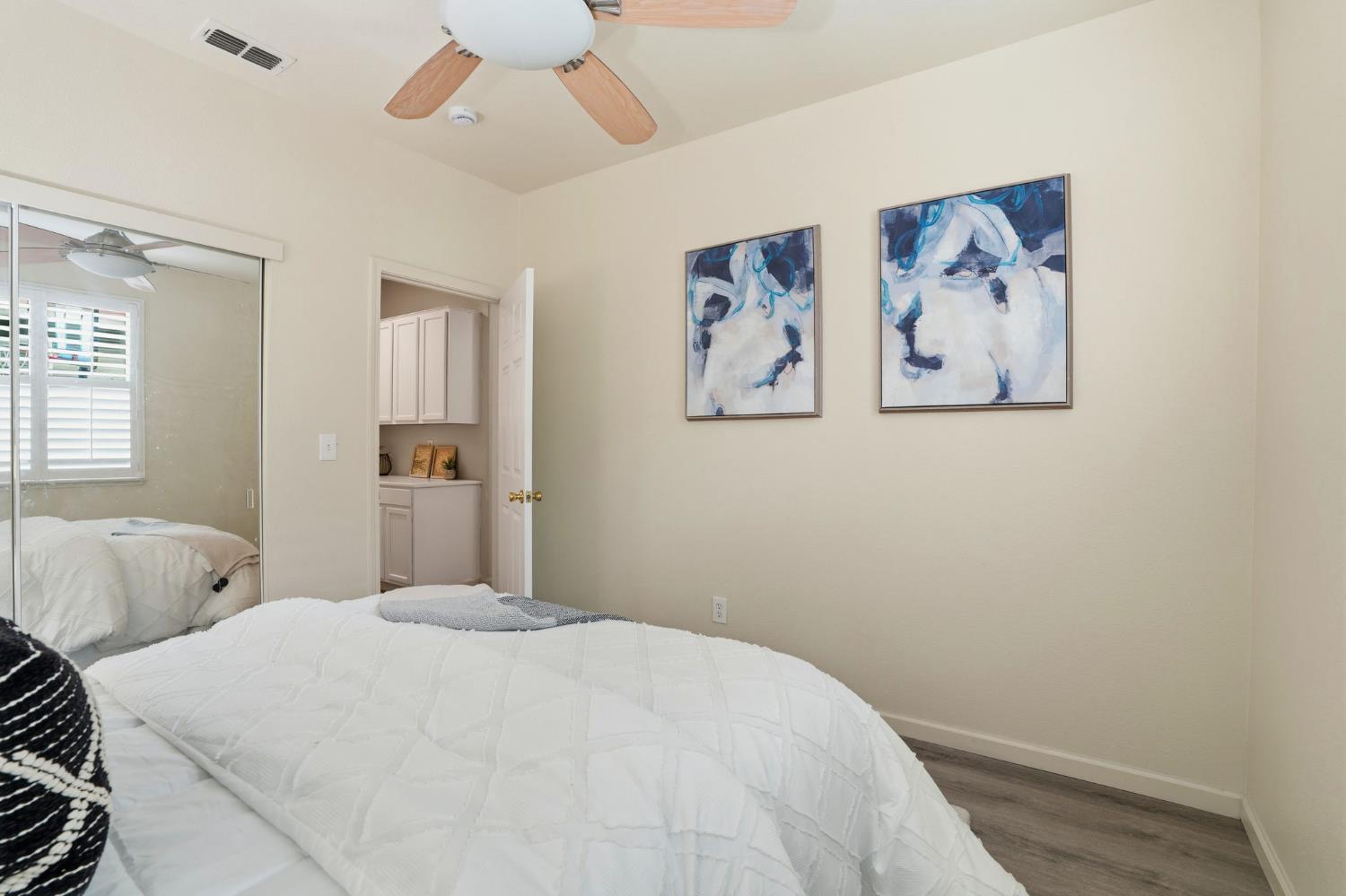 10250 Rudder Way Stockton, CA 95209 - Photo 22 of 46 a bedroom with a large bed and a window