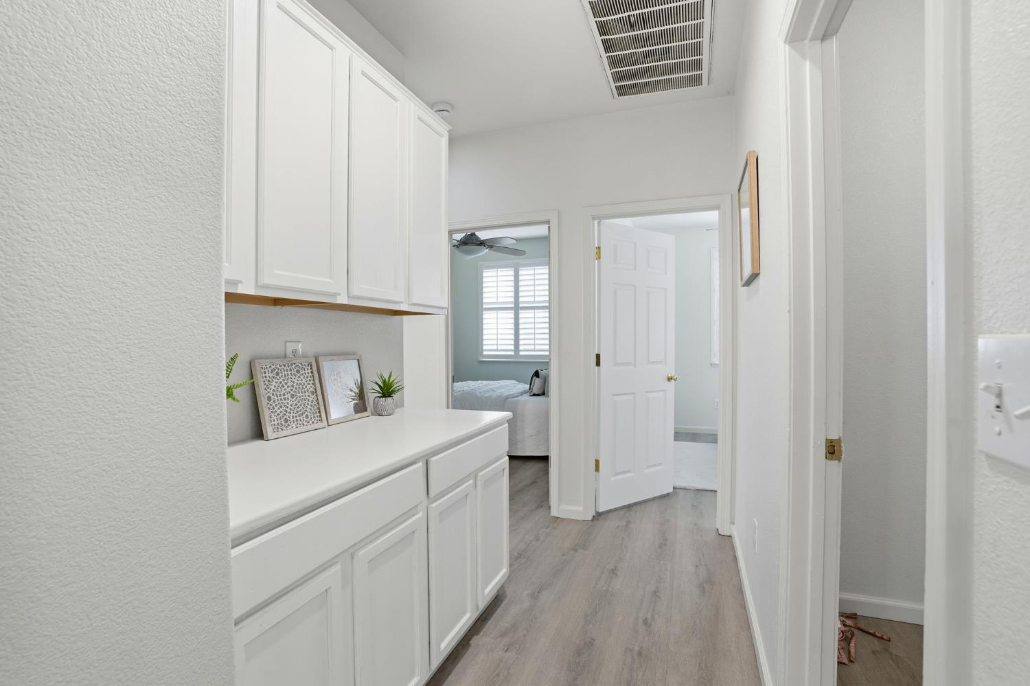 10250 Rudder Way Stockton, CA 95209 - Photo 27 of 46 a view of a bedroom with wooden floor