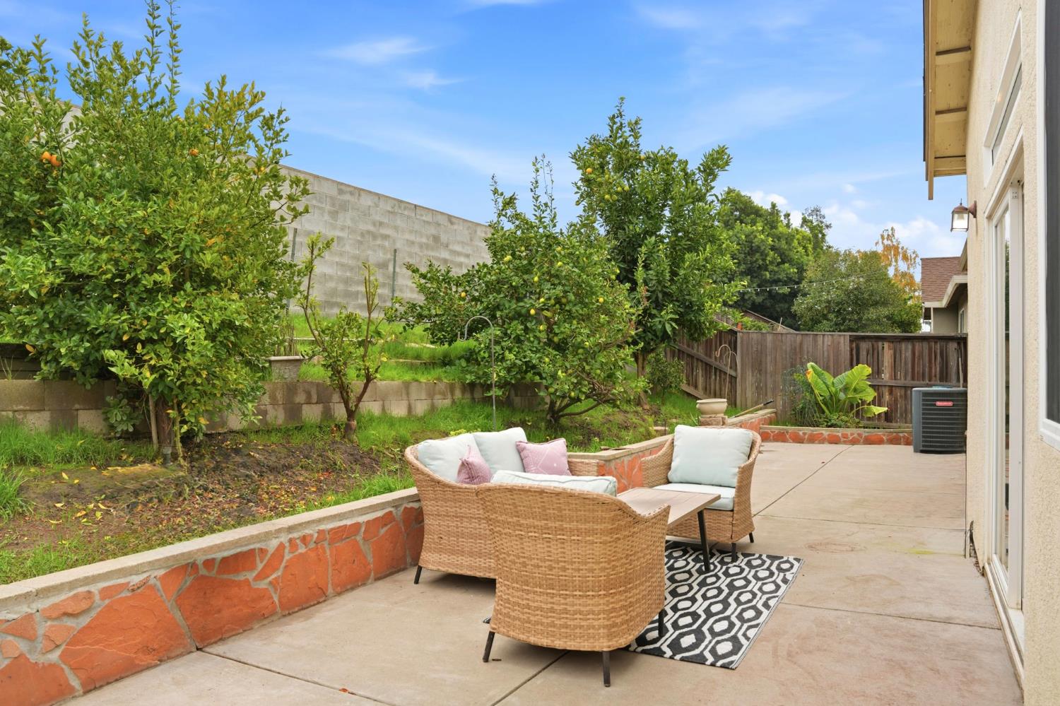 10250 Rudder Way Stockton, CA 95209 - Photo 32 of 46 a view of a patio with couches chairs and a table and chairs with wooden fence