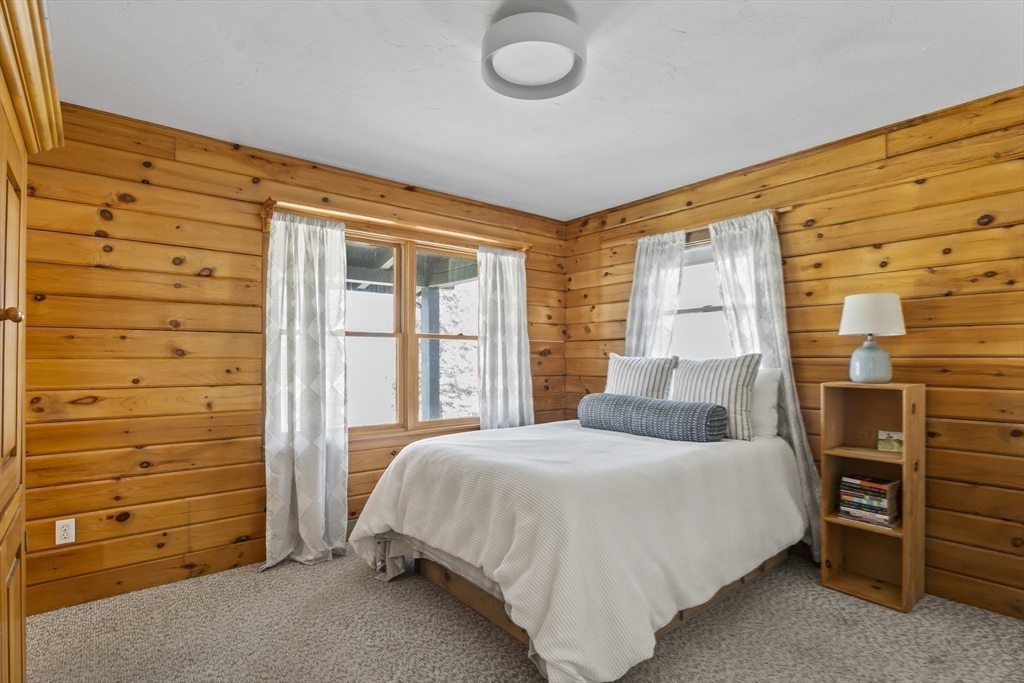 7 Pip'n Road Edgartown, MA 02539 - Photo 28 of 41 a bedroom with a bed and a dresser