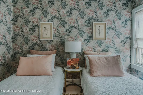 a utility room with a sink stove and cabinets