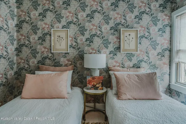 a utility room with a sink stove and cabinets