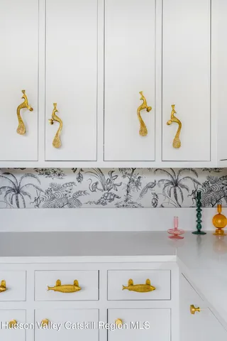 a view of a room with furniture and wooden floor