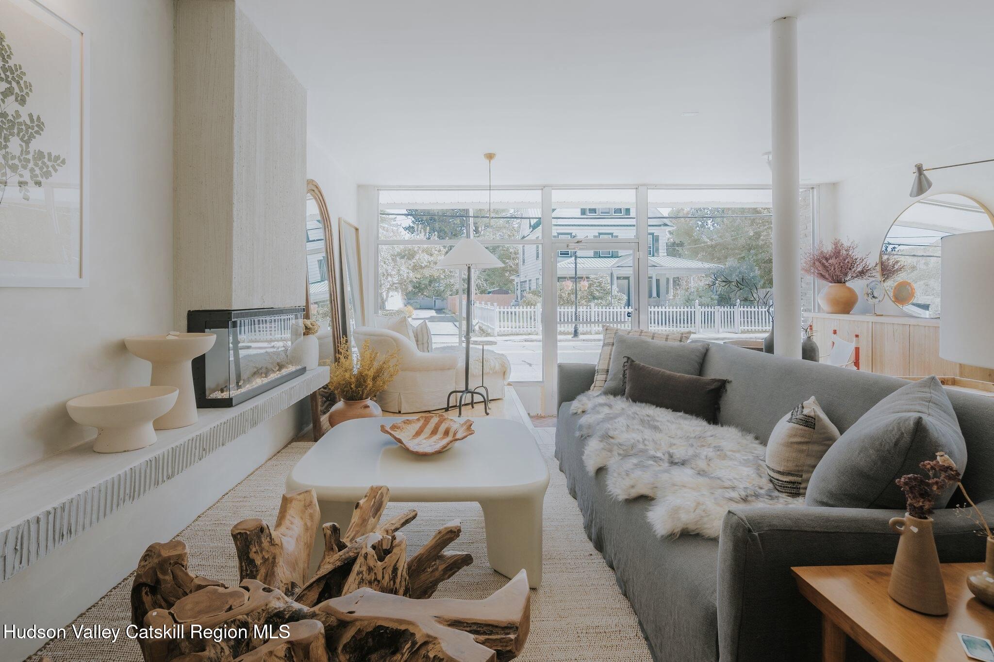 34 Main Street Livingston Manor, NY 12758 - Photo 20 of 20 a living room with furniture and a floor to ceiling window