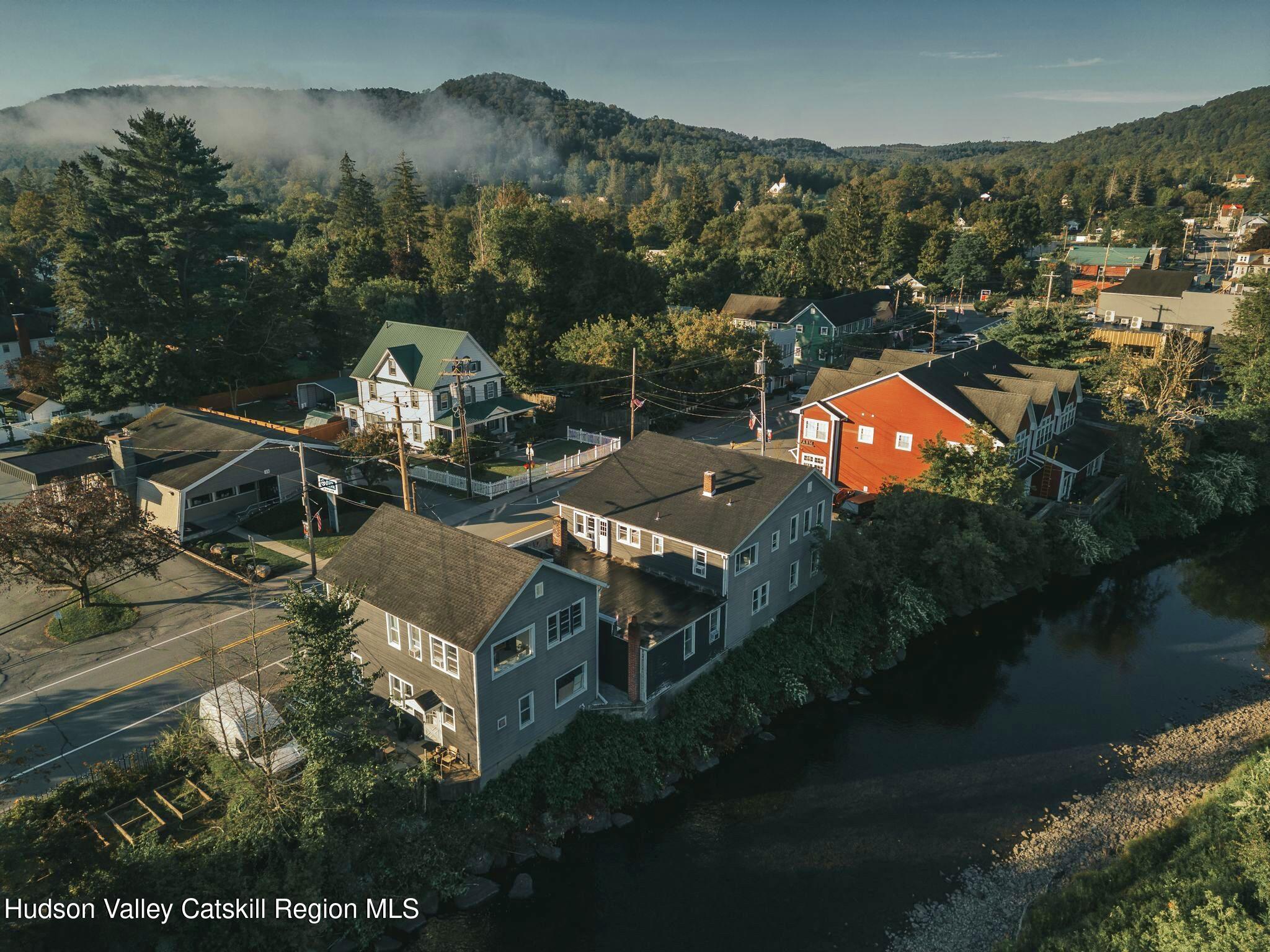 34 Main Street Livingston Manor, NY 12758 - Photo 2 of 20 an aerial view of a house with garden space and lake view