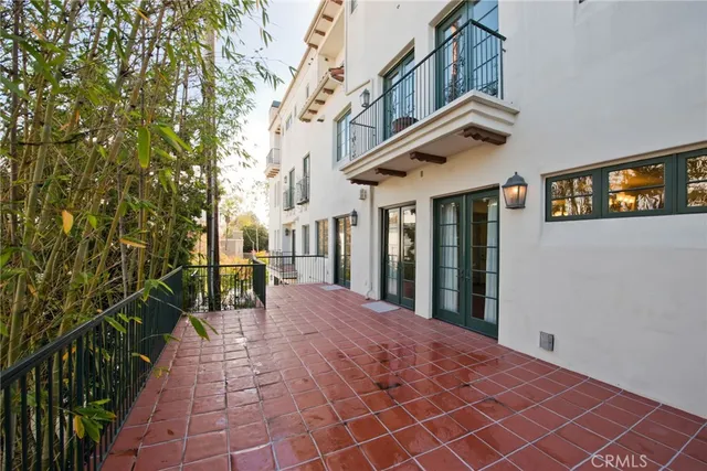 a balcony view with a potted plant