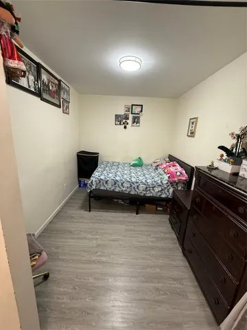 a bedroom with a bed and dresser