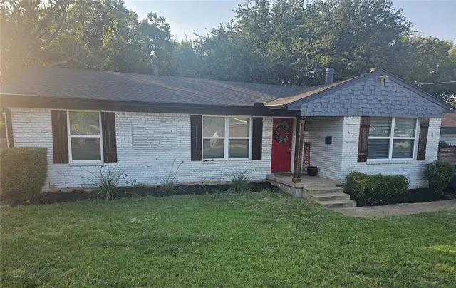 a view of a house with a garden