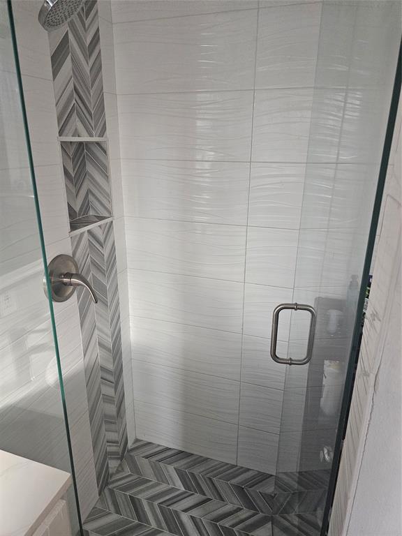 9911 Ferguson Road Dallas, TX 75228 - Photo 14 of 18 a bathroom with a shower