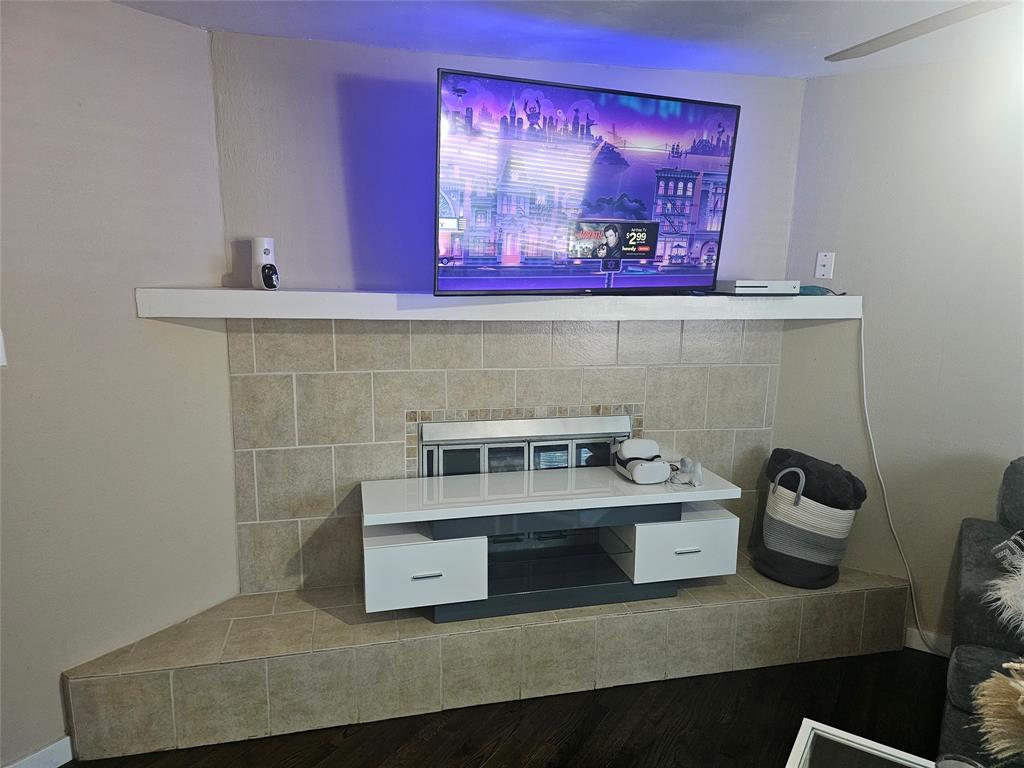 9911 Ferguson Road Dallas, TX 75228 - Photo 3 of 18 a bathroom with a sink and a mirror