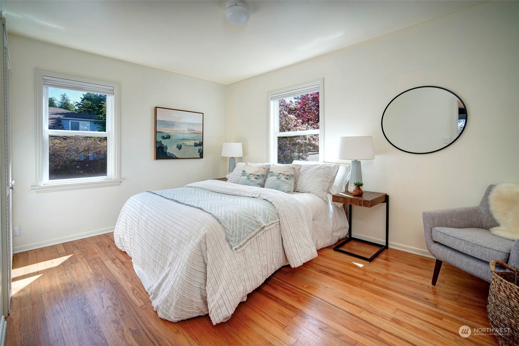 4100 Southwest Ida Street Seattle, WA 98136 - Photo 14 of 32 a bedroom with a bed and wooden floor
