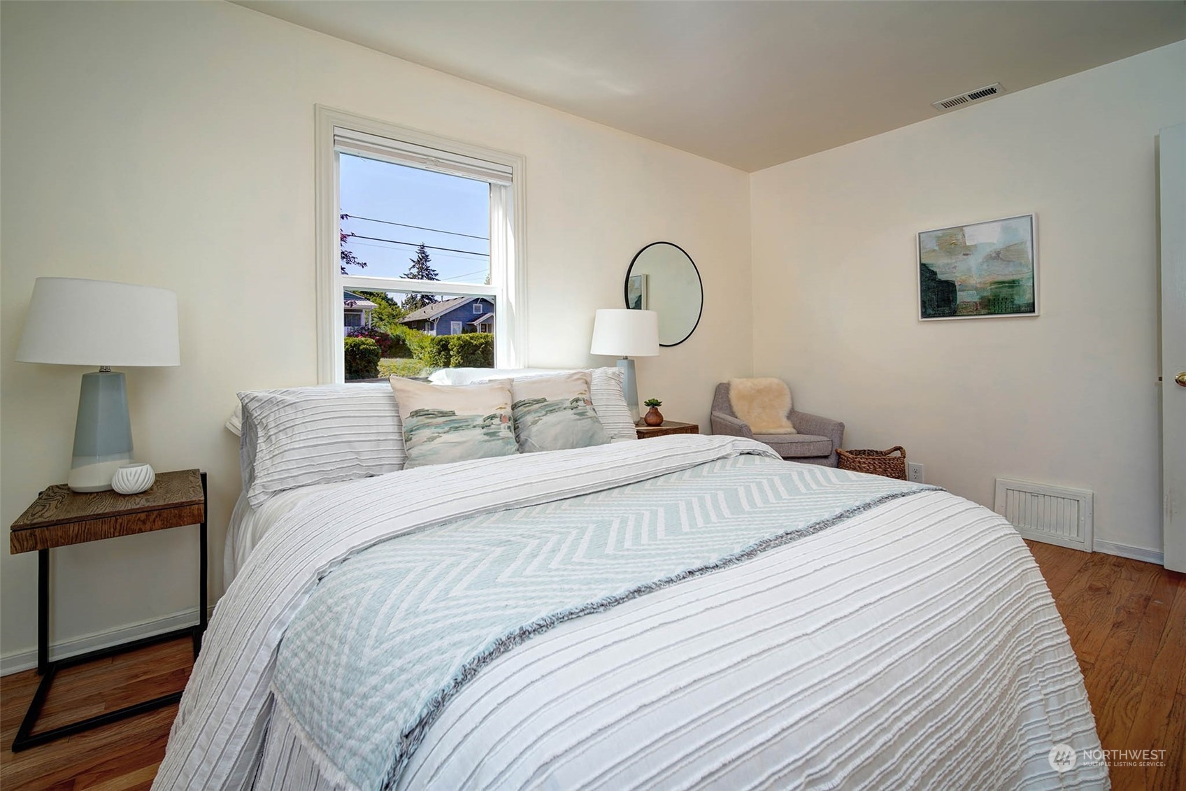 4100 Southwest Ida Street Seattle, WA 98136 - Photo 15 of 32 a bedroom with a bed and a lamp on dresser
